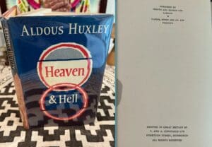 A book titled 'Heaven & Hell' by Aldous Huxley, with a close-up of the title page.