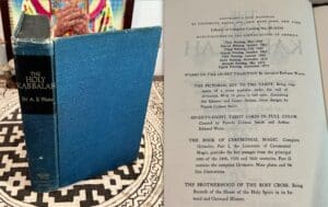 An open book on a patterned surface with a blue cover on the left.